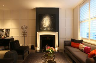 a fireplace with panelled alcoves