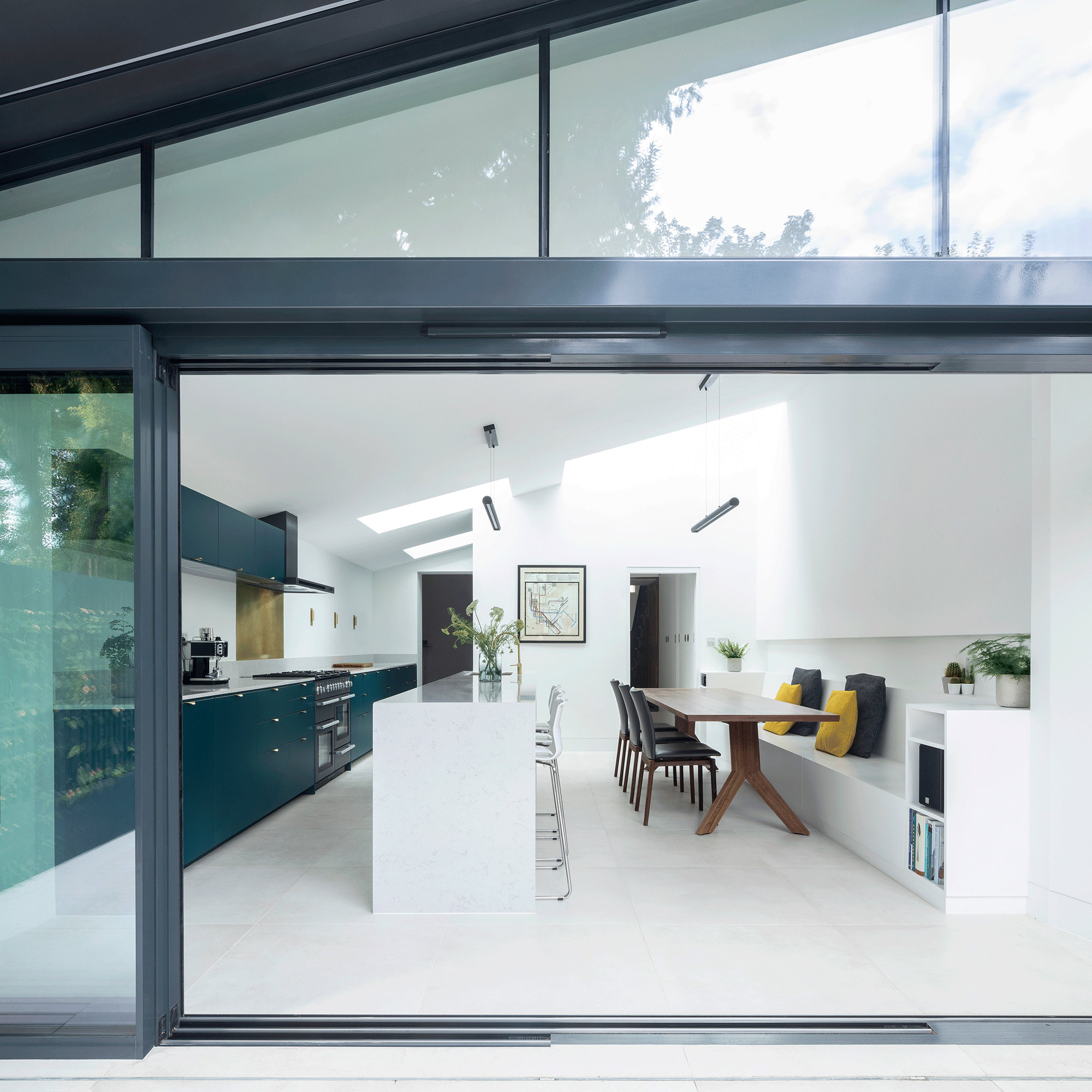 Sliding doors leading into white kitchen