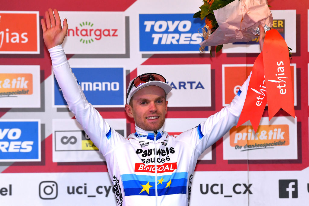 OVERIJSE BELGIUM OCTOBER 31 Eli Iserbyt of Belgium and Team Pauwels Sauzen Bingoal celebrates at podium as race winner after the 62nd Druivencross Overijse UCI CycloCross Worldcup 2021 Mens Elite DruivencrossOverijse CXWorldCup UCIcyclocrossWC on October 31 2021 in Overijse Belgium Photo by Luc ClaessenGetty Images