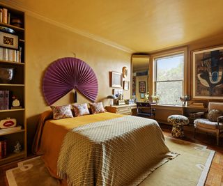 bedroom with FB India Yellow paint fan above bed