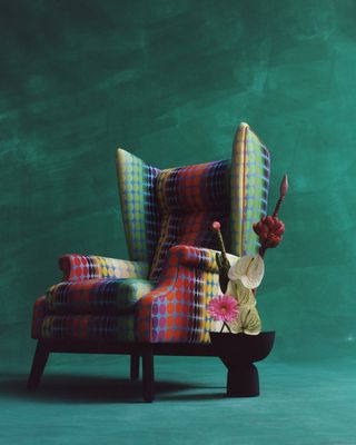 Orior x Christopher John Rogers colourful chair design captured against a green brackground