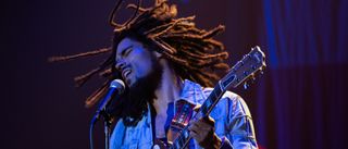 Kingsley Ben-Adir pictured as Bob Marley in concert in Bob Marley: One Love.