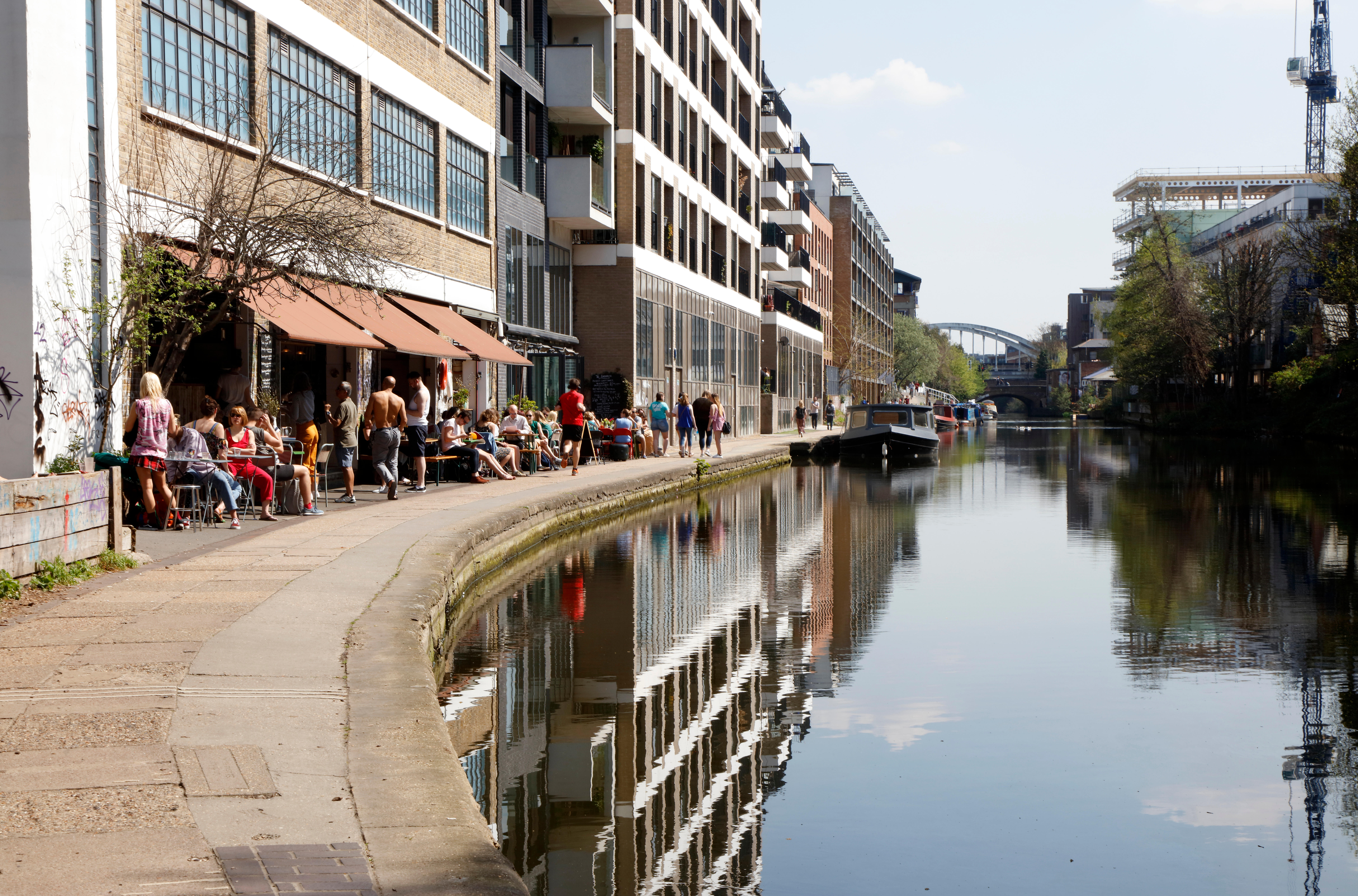 A cafe, build into an industrial building on the bend in a canal