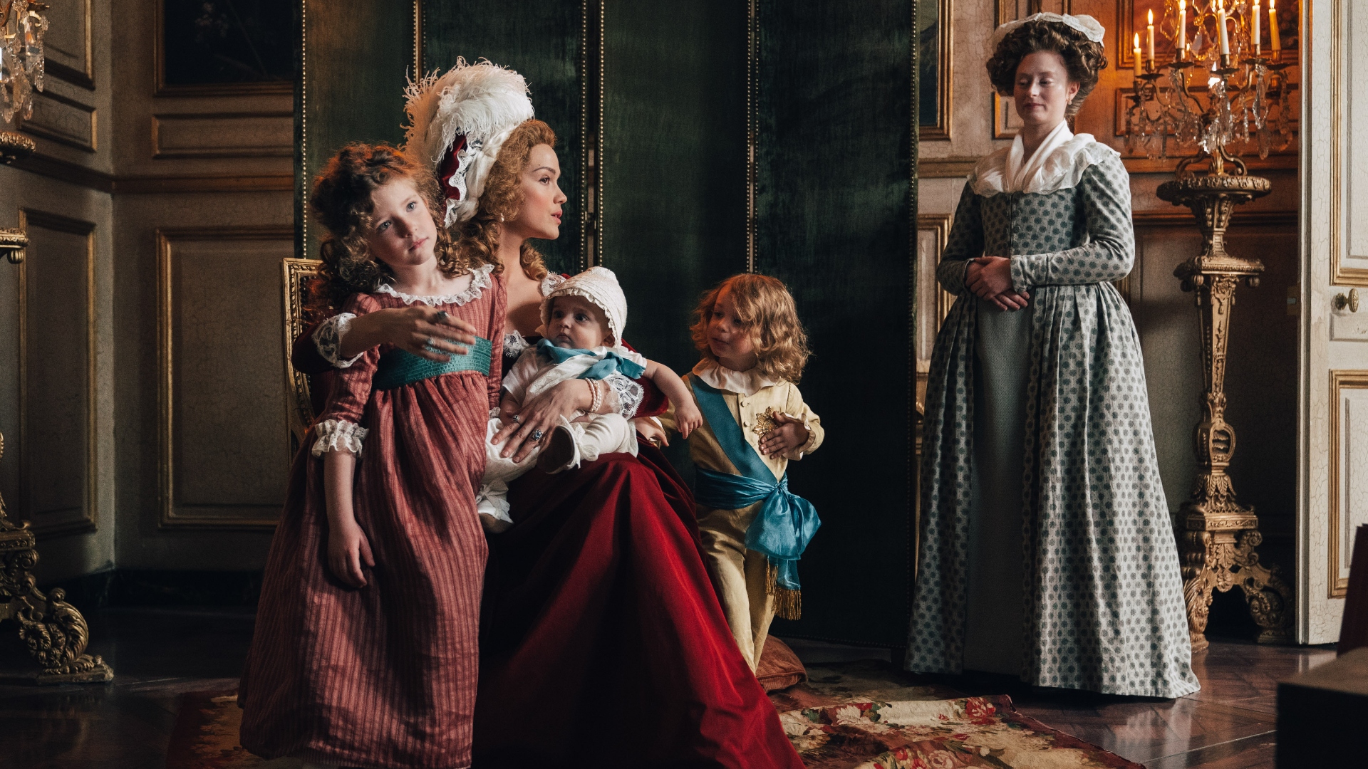 Marie poses with her children for an official portrait in Marie Antoinette