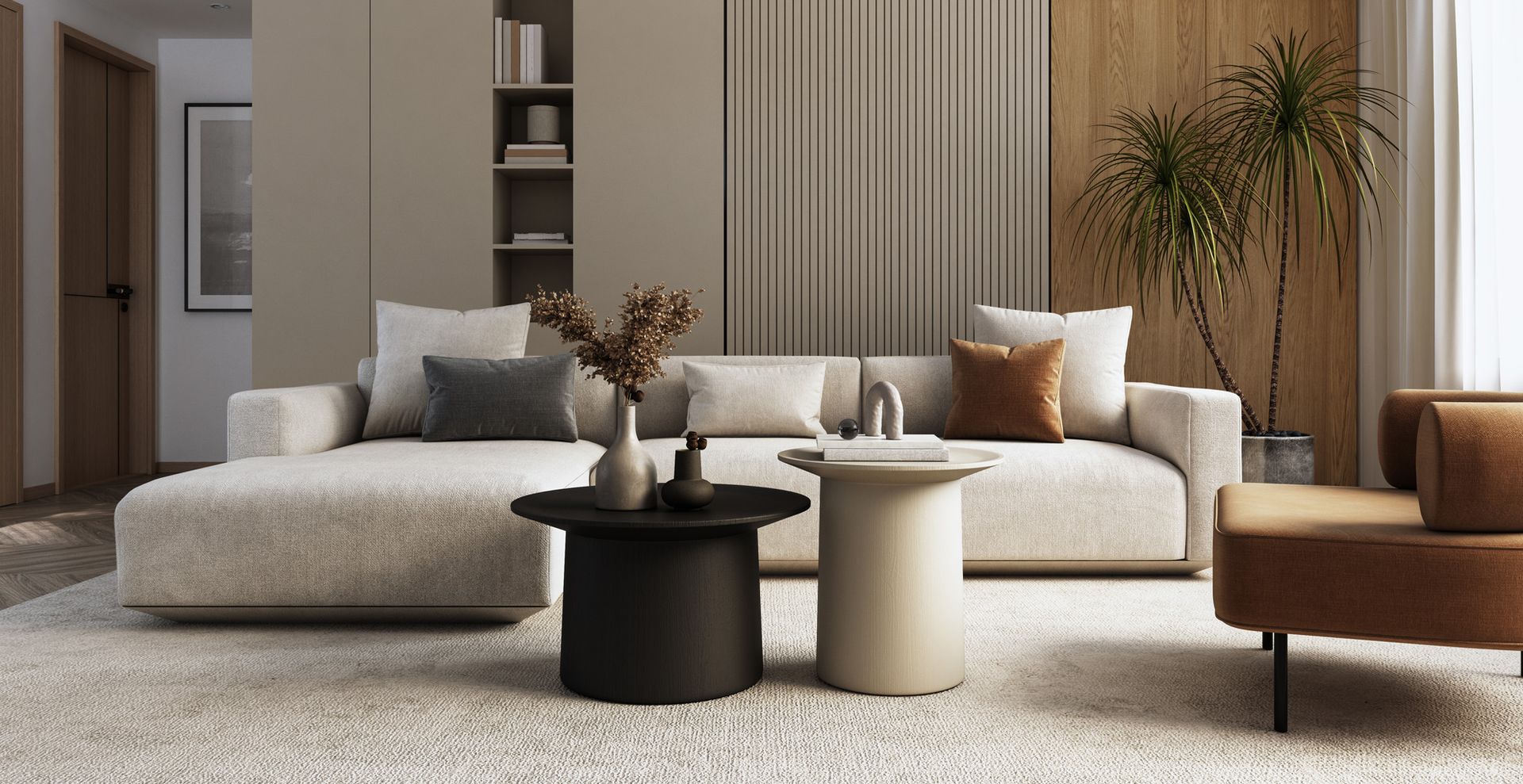 sophisticated living room with soft taupe colored walls and an oversized right-chaise couch to demonstrate how to make a living room look expensive with minimal styling