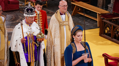 Penny Mordaunt holds the Sword of State during King Charles III's coronation ceremony