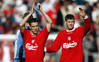 LIVERPOOL - APRIL 12: Michael Owen and Steven Gerrard of Liverpool applaud the fans after the FA Barclaycard Premiership match between Liverpool and Fulham on April 12, 2003 at Anfield in Liverpool, England. Liverpool won the match 2-0. (Photo by Mark Thompson/Getty Images)