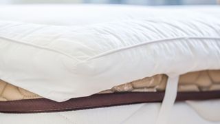 Mattress topper with anchor bands