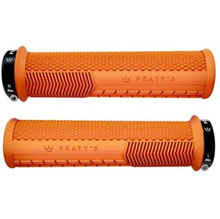 A pair of orange Peaty's Monarch grips on a white background