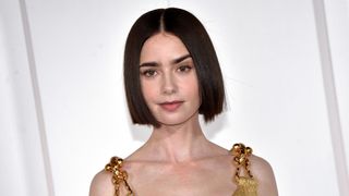 Lily Collins is pictured with a dark brunette bob on the red carpet of the Netflix series Emily in Paris 4 at The Space Cinema Moderno. Rome (Italy), September 10th, 2024