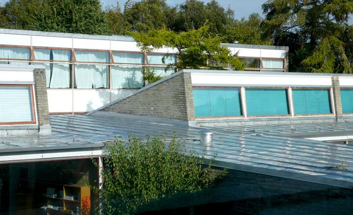 View of roof of school building with roof windows to let in more light.