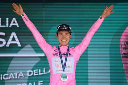 Kristen Faulkner (BikeExchange-Jayco) celebrates wearing the maglia rosa after winning the opening stage of the 2022 Giro Donne