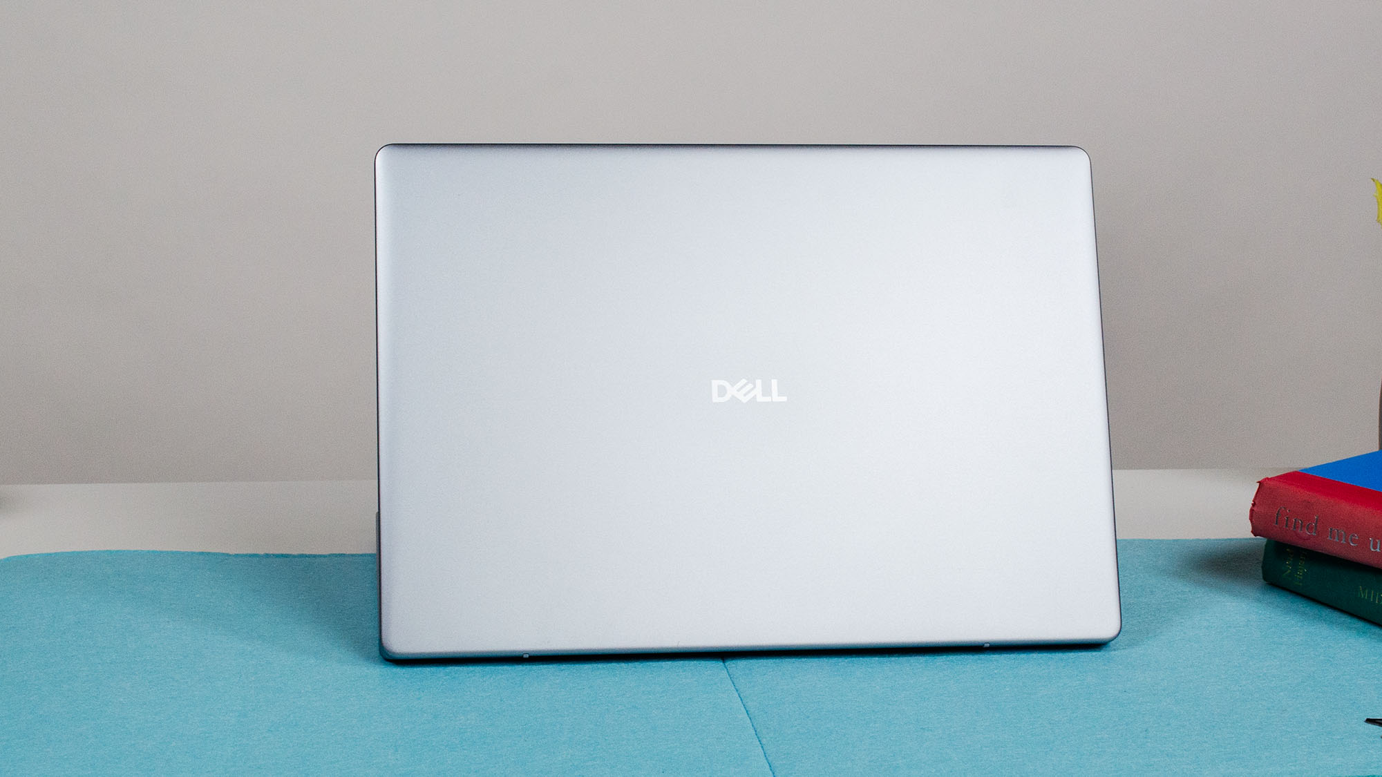 A Dell 16 Plus on a desk with its lid facing out