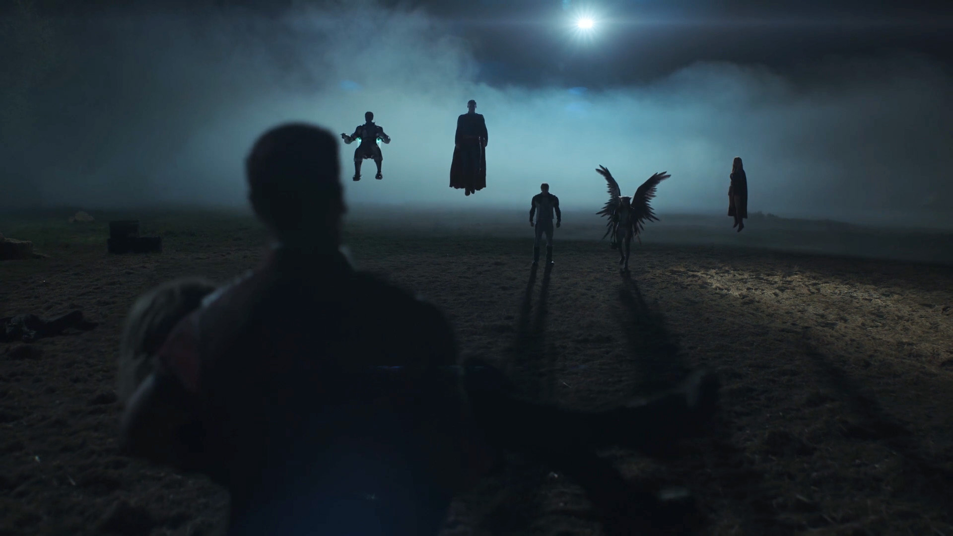 A silhouette shot of the Justice Gang, Superman, and Supergirl at night in Peacemaker season 2 episode 1