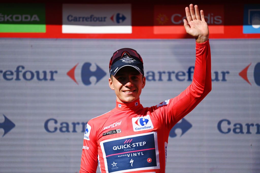 ALTO DEL PIORNAL SPAIN SEPTEMBER 08 Remco Evenepoel of Belgium and Team QuickStep Alpha Vinyl celebrates winning the Red Leader Jersey on the podium ceremony after the 77th Tour of Spain 2022 Stage 18 a 192km stage from Trujillo to Alto del Piornal 1163m LaVuelta22 WorldTour on September 08 2022 in Alto del Piornal Caceres Spain Photo by Justin SetterfieldGetty Images