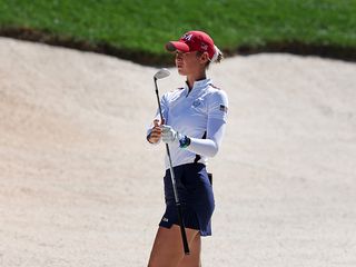 Nelly Korda hitting a bunker shot at the Solheim Cup