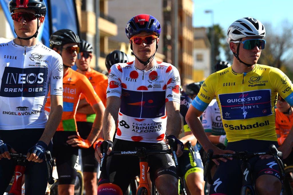 TORRENT SPAIN FEBRUARY 03 LR Carlos Rodriguez Cano of Spain and Team INEOS Grenadiers White Best Young Rider Jersey Benjamin King of United States and Team Human Powered Health Polka Dot Mountain Jersey and Remco Evenepoel of Belgium and Team QuickStep Alpha Vinyl Yellow Leader Jersey prior to the 73rd Volta A La Comunitat Valenciana 2022 Stage 2 a 1715km stage from Btera to Torrent VCV2022 on February 03 2022 in Torrent Spain Photo by Dario BelingheriGetty Images