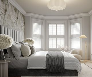 bedroom with white shutters across a bay window