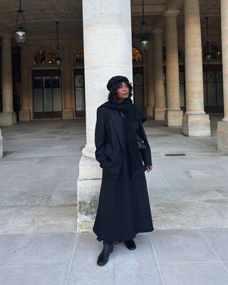 All monochrome black outfit with flat boots