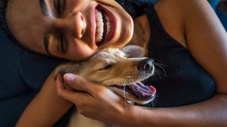 Woman hugging dog