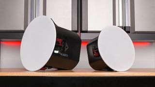 A pair of ceiling speakers with white heads from Pure Resonance.