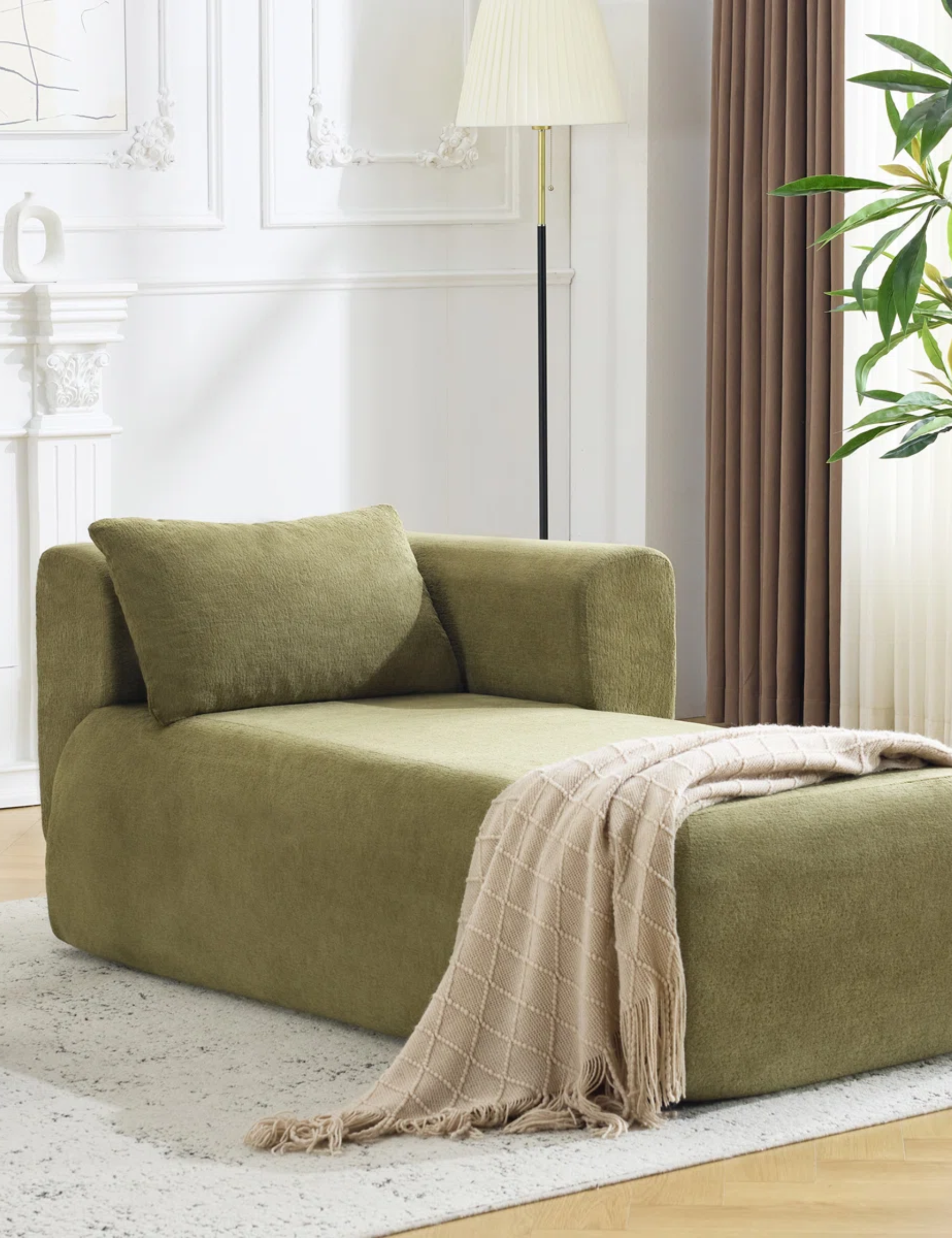 Moss green boneless chaise pictured in an all-white living room