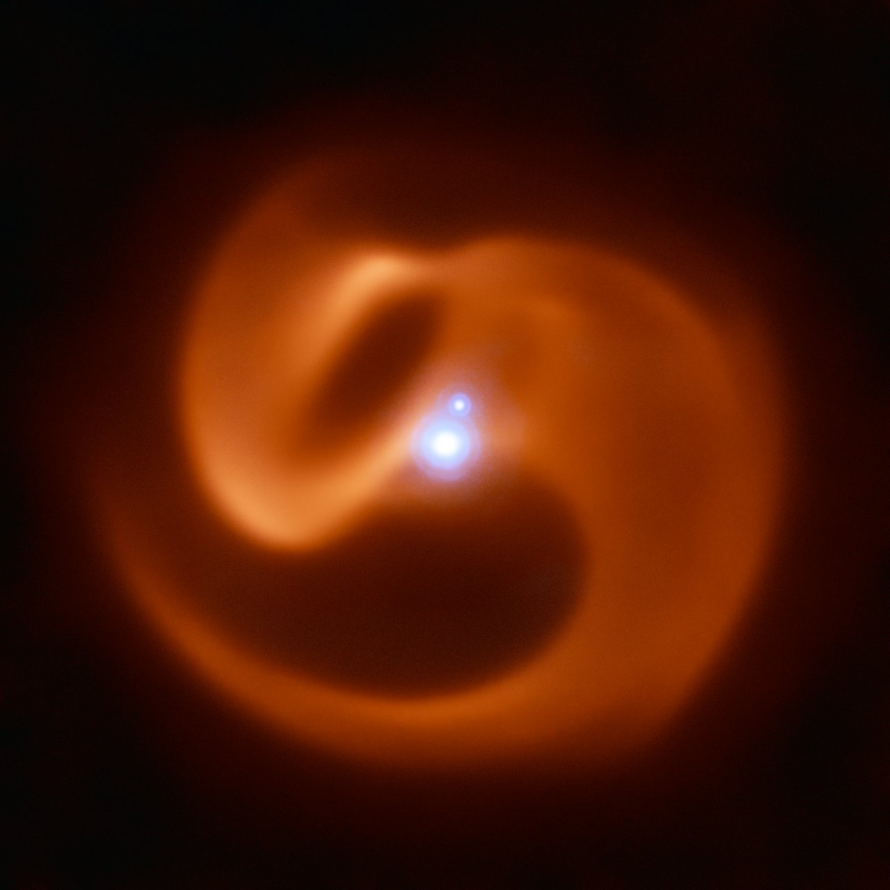 Apep&#039;s stellar streams coil around the knot of orbiting stars at its core in this image from the European Organisation for Astronomical Research in the Southern Hemisphere&#039;s Very Large Telescope.