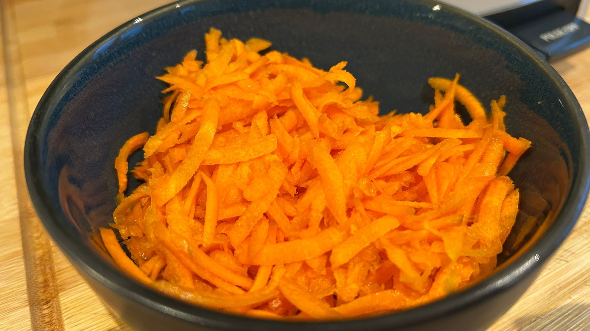 Bowl of carrot shredded using Cuisinart Flexprep 1.1L food processor