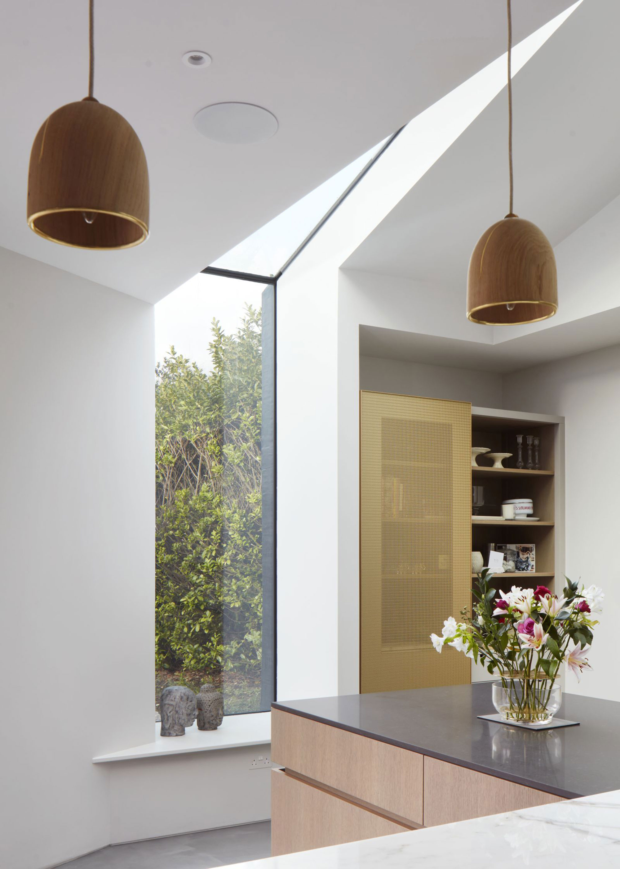 full height triangular window in kitchen