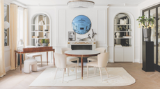 Neutral open living space with table and desk.