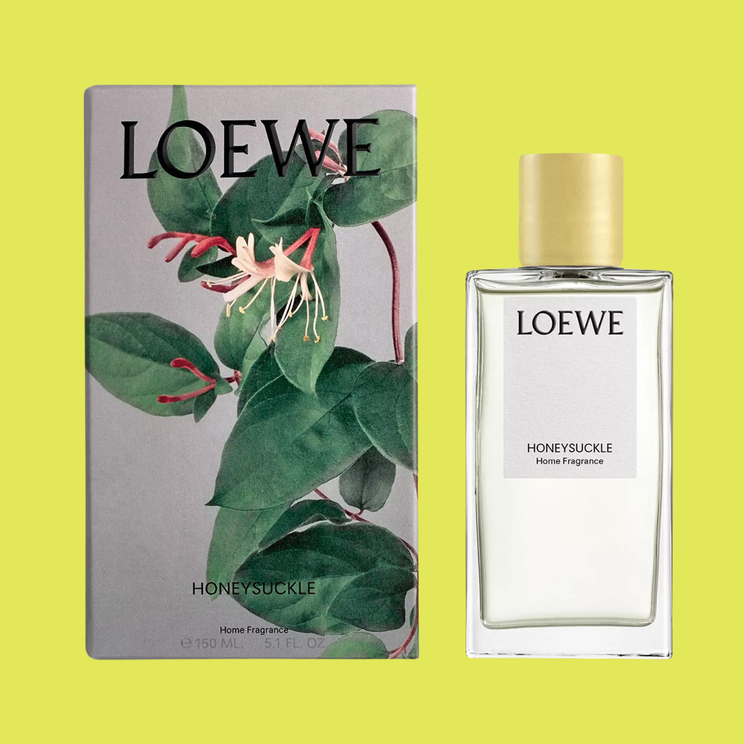 A bottle of honeysuckle room spray by a box