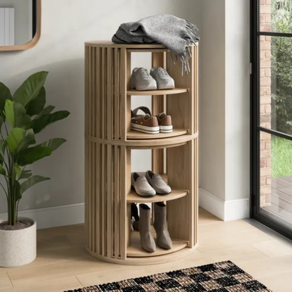 Ria rotating shoe storage by front door.