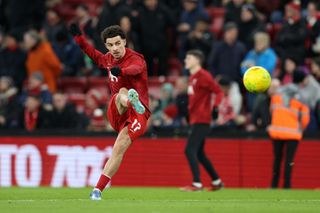 Curtis Jones of Liverpool warms up prior to the Carabao Cup Semi Final First Leg match between Liverpool and Fulham at Anfield