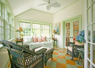 sunroom ideas with green framed windows and checkerboard floor