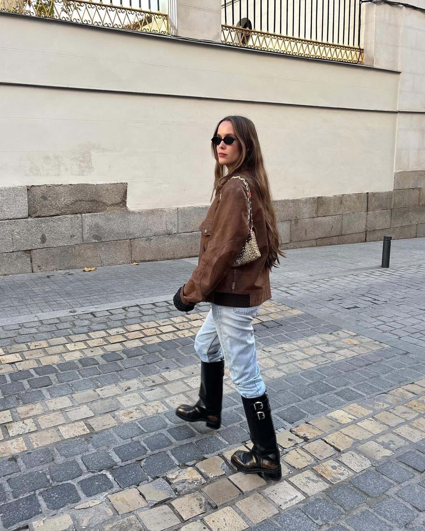 Influencer wearing knee high boots for winter.