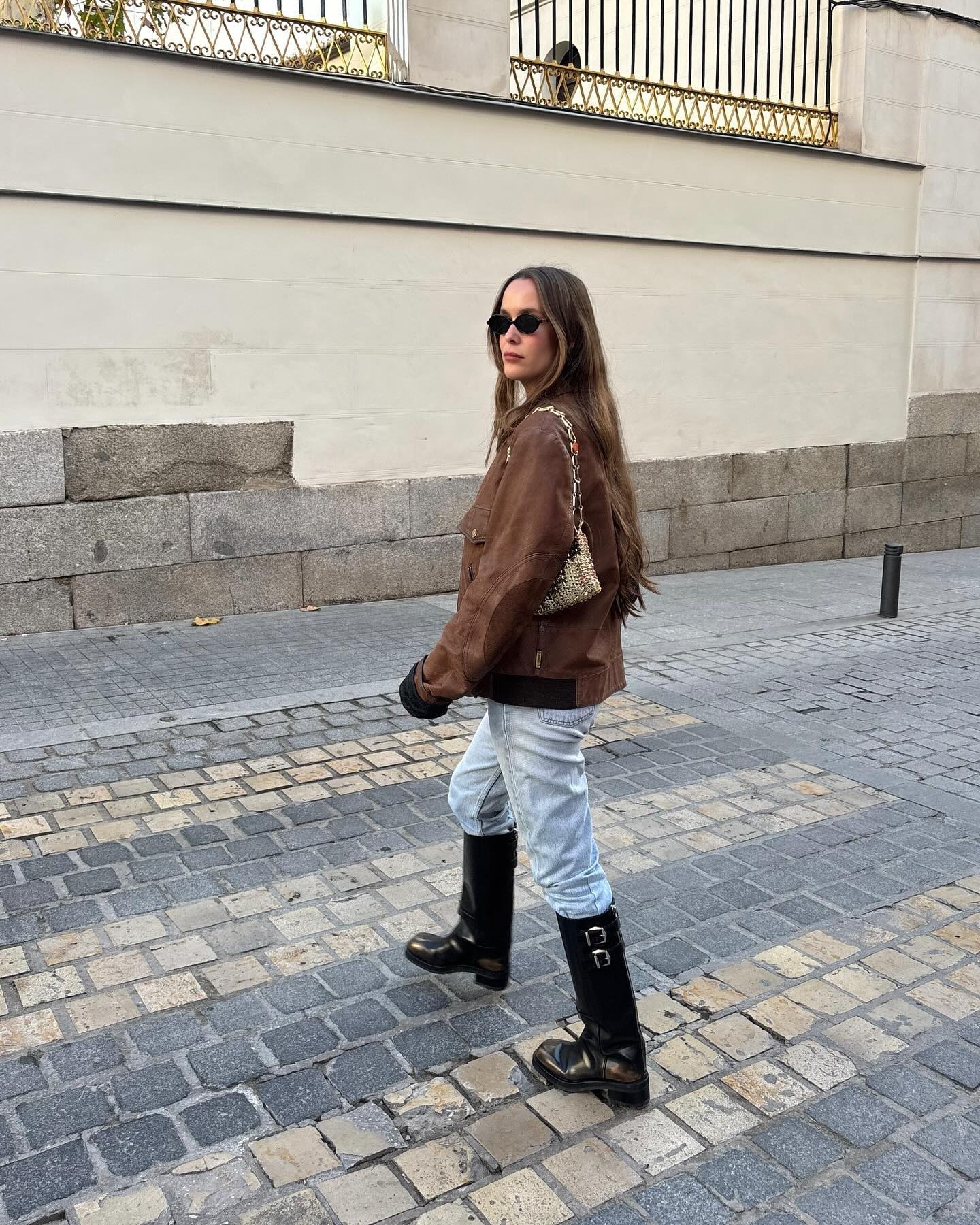 Influencer wearing knee high boots for winter.