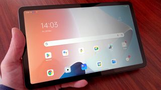 Oppo Pad Air review: hand holding Oppo Pad Air tablet
