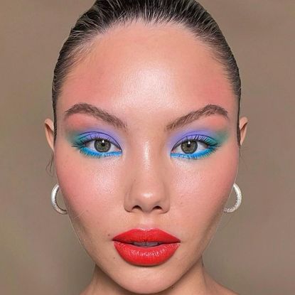model wearing blue and purple and green eyeshadow