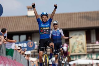 Mauro Schmid gestures after being cut off by Koen Bouwman in the Giro d'Italia stage 19 sprint