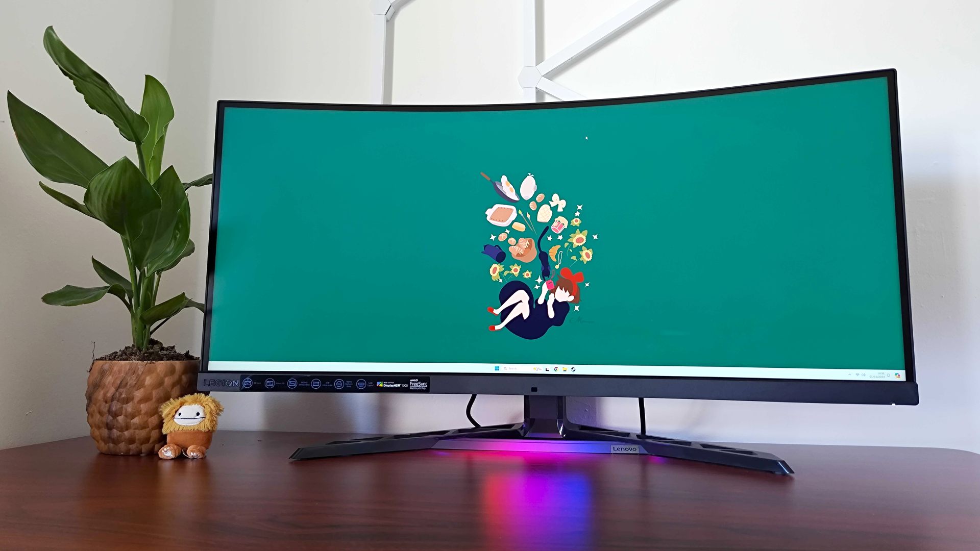 Lenovo Legion Y34wz-30 sitting on desk with Kiki's Delivery Service wallpaper on screen