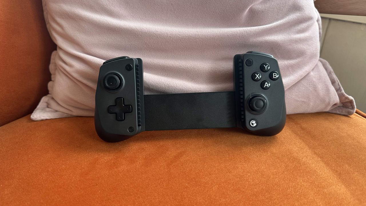 The GameSir X5s on a small living room chair