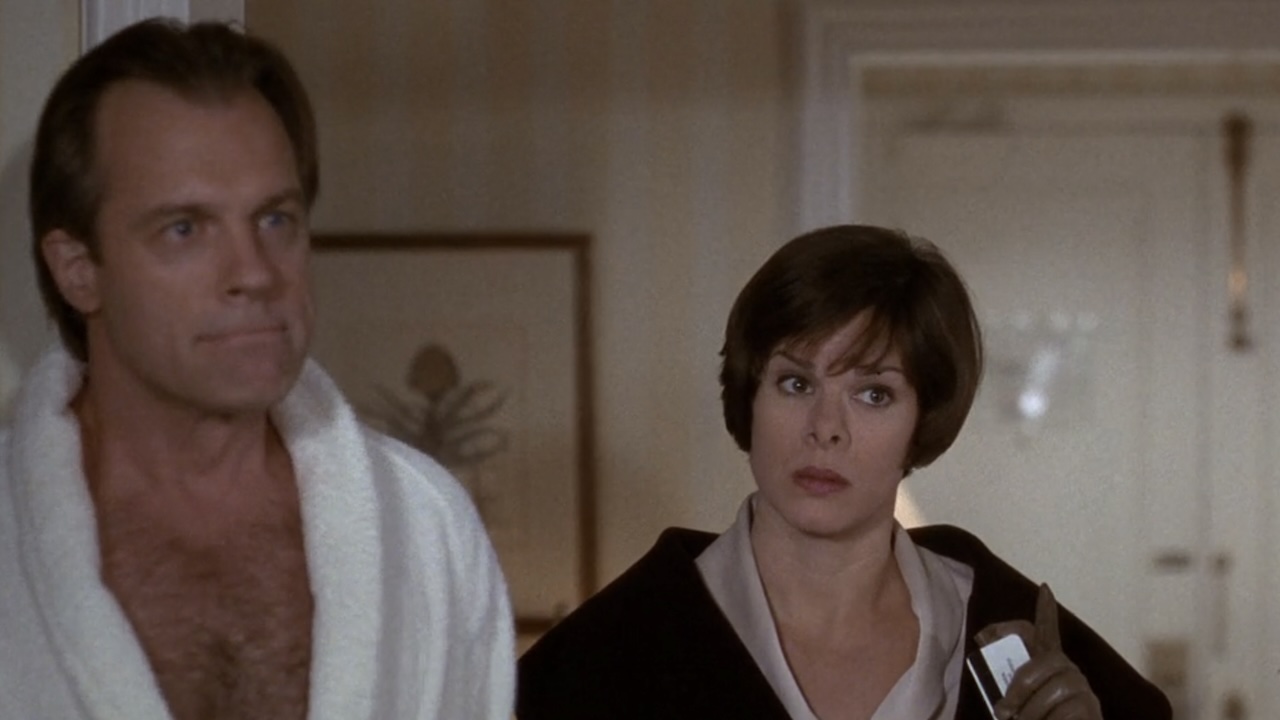 Aaron (Stephen Collins) and Dr. Rosen (Marcia Gay Harden) looking concerned in The First Wives Club