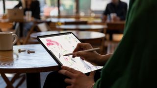 How to relax on Mother's Day: a woman sketches on an Apple iPad Pro