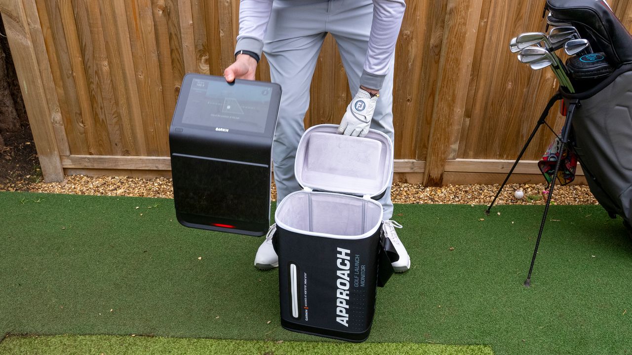Garmin Approach R50 being taken out of case