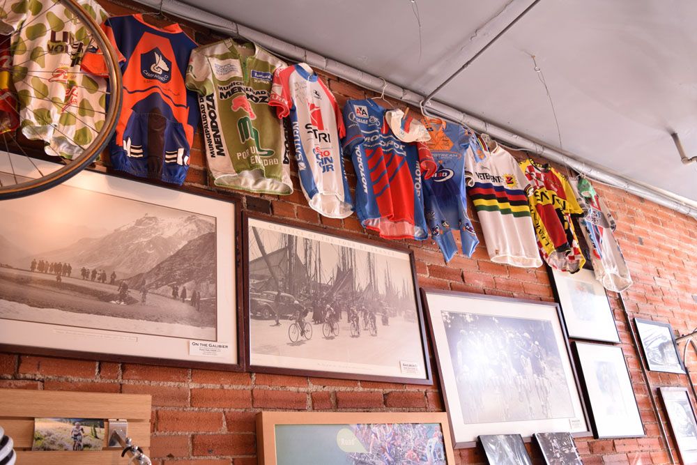 The walls of Vecchio's Bicicletteria are decorated with jerseys from cycling's rich and diverse history