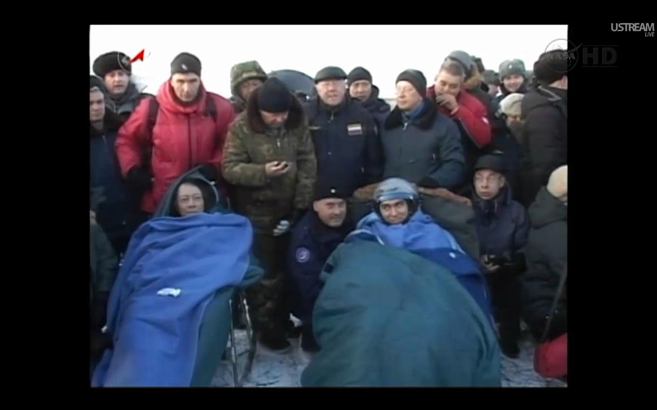 NASA astronaut Mike Fossum (left) and Russian cosmonaut (right) are pictured shortly after their Soyuz TMA-02M spacecraft touched down on the Central Asian steppes of Kazakhstan on Nov. 21, 2011.