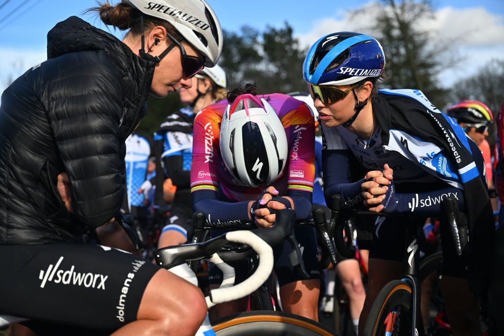 WAREGEM BELGIUM MARCH 27 LR Lotte Kopecky of Belgium Chantal van den BroekBlaak of The Netherlands Mischa Bredewold of The Netherlands and Team SD Worx Protime and the womens peloton is stopped due to a twocar accident after the mens race there will be no climb of the Knokteberg Trieu during the 12nd Dwars door Vlaanderen 2024 Womens Elite a 1299km one day race from Waregem to Waregem on March 27 2024 in Waregem Belgium Photo by Luc ClaessenGetty Images