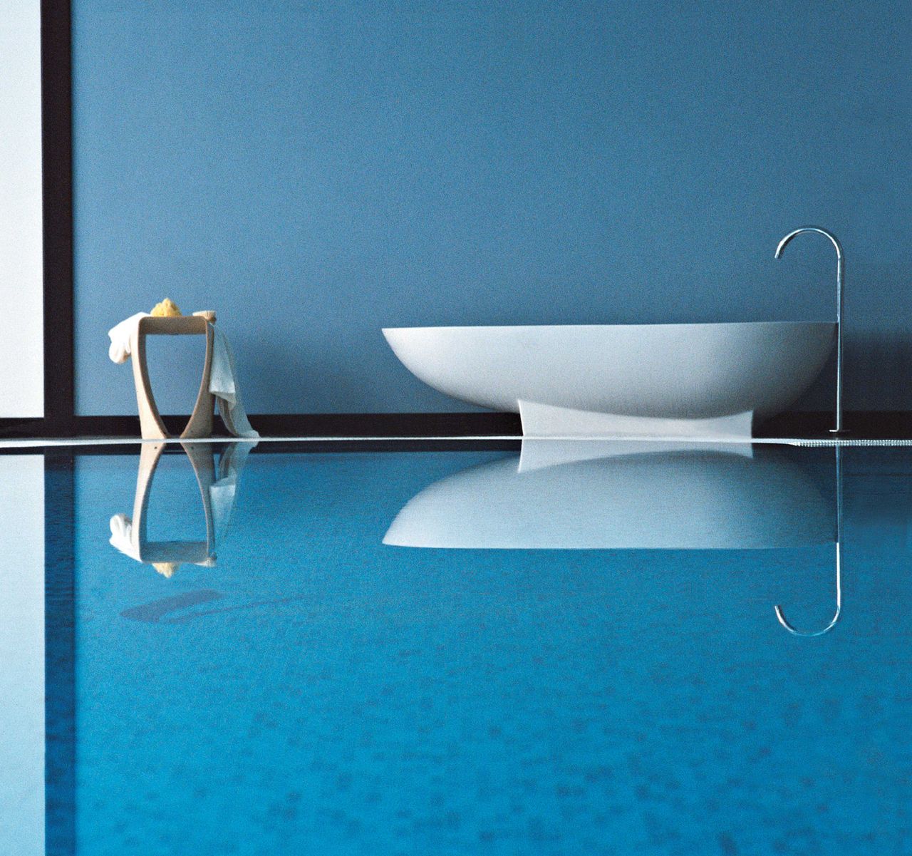 Agape Spoon Bathtub, designed by Benedini Associati in 1998. The photgraph by Josè Rodriguez is part of Agape&#039;s anniversary celebration at its Bosco HQ near Mantua