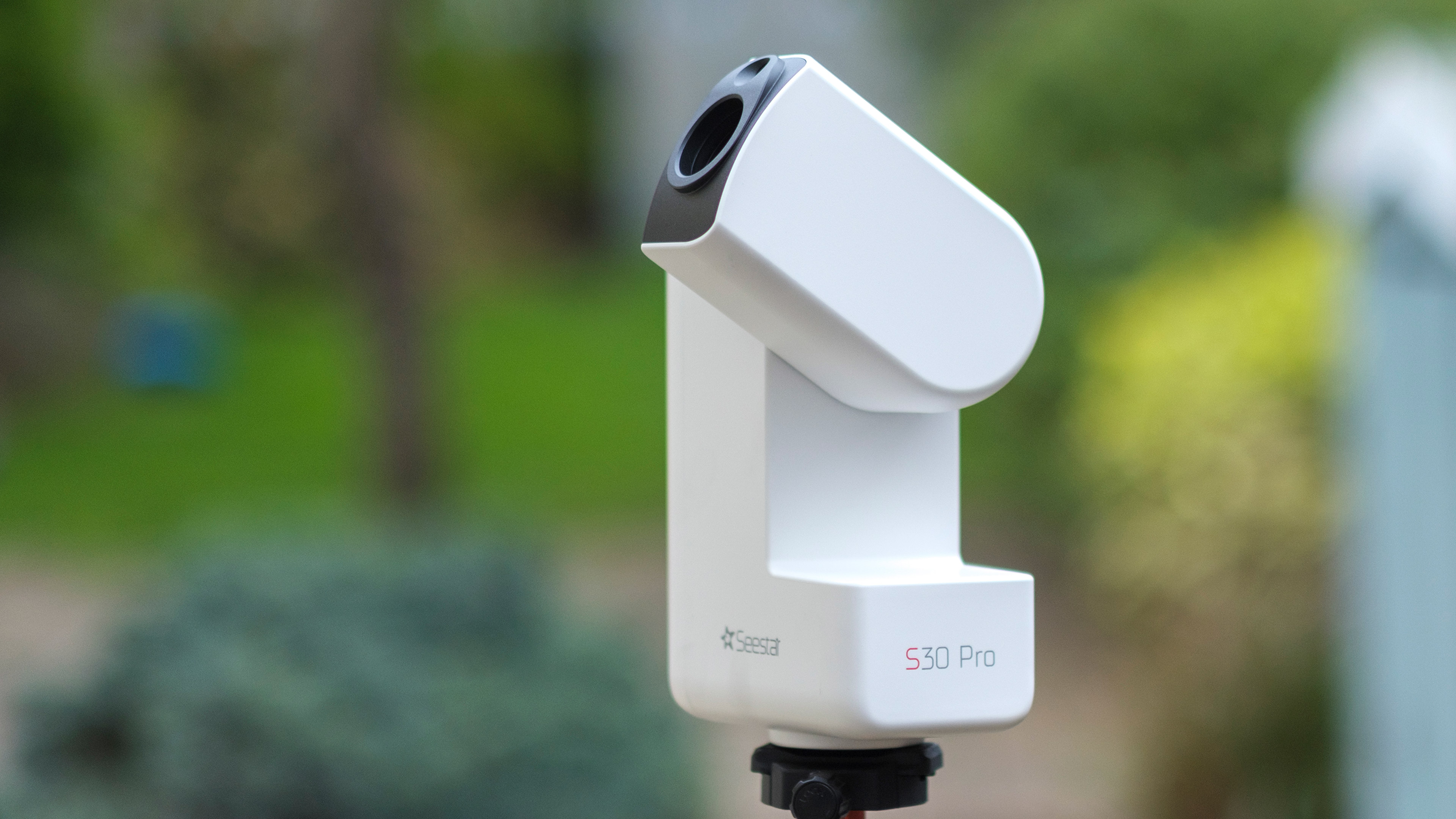 The ZWO Seestar S30 Pro showing the device's front and side, with the arm open