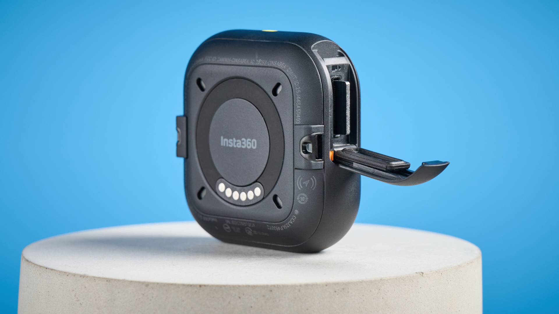 Insta360 Go Ultra core camera against a blue background